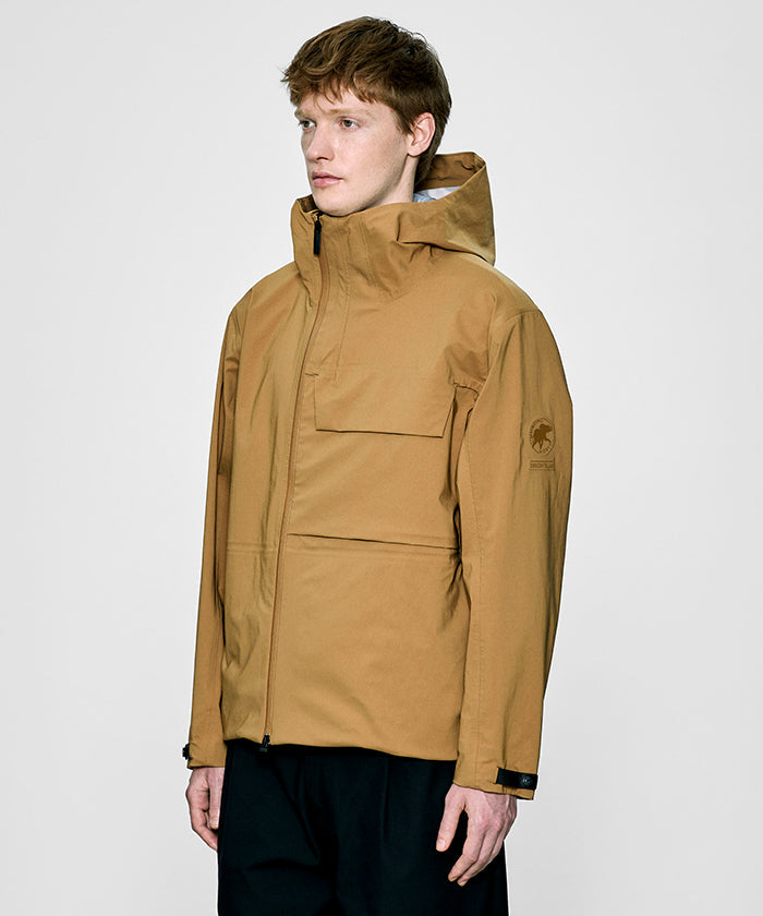 CRAFTED BY DESCENTE.LAB[ハードシェル アシンメトリーフィールドジャケット FWB61M]キャメル6234600434メンズ HUNTING WORLD